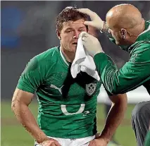  ?? STUFF ?? Irish great Brian O’Driscoll receives some attention while playing against the All Blacks.