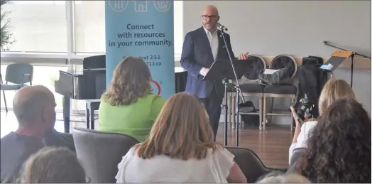  ?? Photo by Matthew Liebenberg ?? United Way of Saskatoon and Area CEO Shaun Dyer speaks at the launch of the 211 service expansion in Swift Current, June 2018.