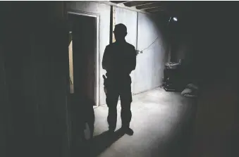  ??  ?? Drew Miller stands inside a fortified bunker that is still being built. Fortitude Ranch can hold up to 500 people.