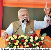  ??  ?? PM Narendra Modi addresses an election rally in Fatehpur on Sunday