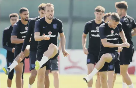  ??  ?? England skipper Harry Kane (left) and Jamie Vardy put in the work in training ahead of tonight’s clash with Belgium.