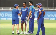  ?? Courtesy: BCCI ?? Mumbai Indians’ Sachin Tendulkar, Zaheer Khan and Mahela Jayawarden­e have a chat before the start of the match.