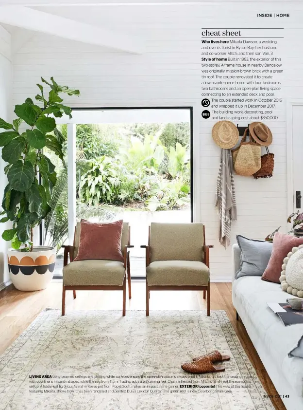  ??  ?? LIVING AREA Lofty beamed ceilings and striking white surfaces ensure the open-plan space is always bright. Mikarla has kept the seating relaxed with cool linens in sandy shades, while the rug from Tigmi Trading adds a welcoming feel. Chairs inherited from Mitch’s family suit the easygoing set-up. A fiddle-leaf fig ( Ficus lyrata) in Rosso pot from Pop & Scott makes an impact in the corner. EXTERIOR (opposite) This view of the house, featuring Mikarla, shows how it has been rendered and painted Dulux Lexicon Quarter. The green roof is now Colorbond Shale Grey.