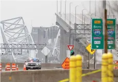  ?? — AFP photo ?? Police block off the approach of the collapsed Francis Scott Key Bridge in Baltimore.