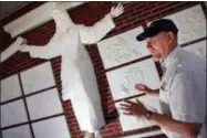  ?? GERRY MELENDEZ — THE STATE VIA AP ?? This 2017file photo Bert Baker, an amateur artist, stands in front of a recently finished seven-foot tall sculpture of Christ at Red Bank Baptist Church in Lexington, S.C. The sculptor says his statue of Jesus Christ is being removed from a the church...