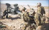  ?? Sgt. Justin Updegraff U.S. Marine Corps ?? U.S. TROOPS, like these at Bost airfield in Afghanista­n, were allegedly the targets of Russia.