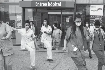  ?? VALERY HACHE / AGENCE FRANCE-PRESSE ?? Medical staff dance in front of the Pasteur Hospital as part of a daily tribute to health workers in Nice, France, on Monday.