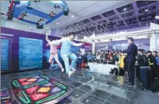  ?? PHOTOS PROVIDED TO CHINA DAILY ?? Two dancers display their skills on the footboard of the E5 Dance machine in the finals of the 2017 China Electronic Game Super League in Wuhan, Hubei province, in November.