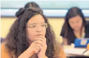  ?? GREG SORBER/JOURNAL ?? Alyssa Fontaine, 17, listens during a financial literacy course at Bernalillo High School on Monday. The free summer class covers 18 modules including investing, taxes and paying for college.