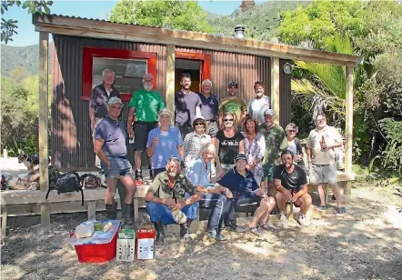  ??  ?? Caro Bartlett, Tennyson Inlet Boat Club committee member A group of volunteers in front of the finished hut at Matai Bay.