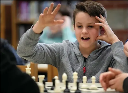  ?? ?? Eli Marquis, a Reeds Brook Middle School student, reacts during an after-school chess team match.