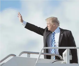  ?? AP PHOTO ?? CRITICIZED FOR RESPONSE: President Trump boards Air Force One at Palm Beach Internatio­nal Airport in West Palm Beach, Fla., yesterday. Trump spent the weekend in South Florida, an hour’s drive from the site of a recent school shooting.