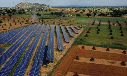  ?? Hussain/AFP/Getty Images ?? A solar plant in the northern Indian state of Rajasthan. Economies of scale mean solar panels have become cheaper. Photograph: Sajjad