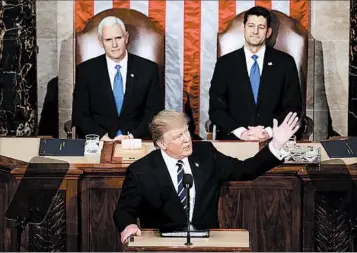  ?? CHIP SOMODEVILL­A/GETTY ?? President Donald Trump addresses Congress on Tuesday as Vice President Mike Pence, left, and Speaker Paul Ryan listen.
