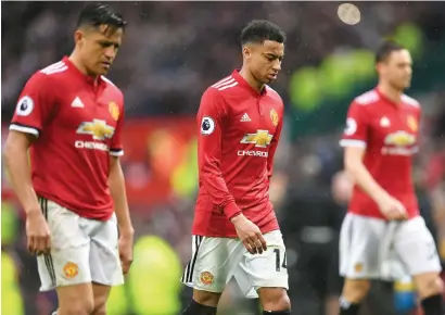  ?? AFP ?? Manchester United’s players walk off after defeat against West Bomwich Albion during the Premier League match. —