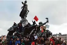  ?? Lewis Joly/Associated Press ?? Protesters demonstrat­e against plans to push back France’s retirement age from 62 to 64 on Saturday in Paris.