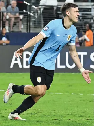  ?? — AFP ?? Manuel Ugarte celebrates after scoring in a penalty shoot-out .