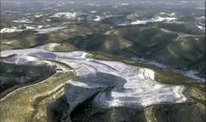  ?? Bob Bird/Associated Press ?? Appalachia­n peaks near Kayford, W.Va., subjected to mountain top removal in January 2000.