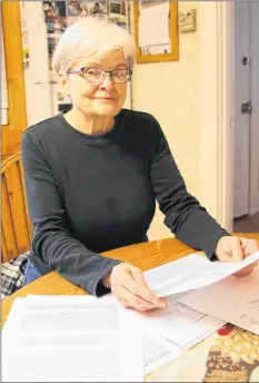  ?? CAROLE MORRIS-UNDERHILL ?? Ruth Ross, armed with correspond­ence that she’s written and received about the Hantsport aboiteau situation, is frustrated by the lack of answers.