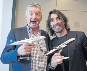  ?? EPA ?? Ryanair’s CEO Michael O’Leary, left, and tour operator Globalia’s executive director Javier Hidalgo pose for photograph­ers as they announce a partnershi­p between Ryanair and Globalia’s airline Air Europa in Madrid, Spain last Tuesday. The agreement...