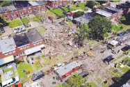  ?? JULIO CORTEZ/ASSOCIATED PRESS ?? Debris and rubble covered the ground in the aftermath of an explosion in Baltmore on Monday. Firefighte­rs say the blast leveled several homes.
