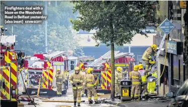  ?? KEVIN SCOTT ?? Firefighte­rs deal with a blaze on the Woodvale Road in Belfast yesterday (also inset)