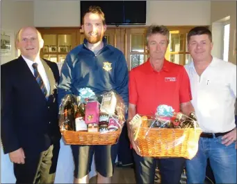  ??  ?? Patrick McEntee & Raphael Smyth are presented with second prize for the Open Fourball competitio­n at Laytown & Bettystown by Captain Denis Taylor and sponsor Ray Gough of Gough’s of Ardcath.