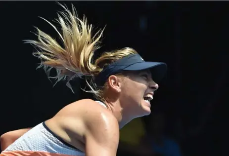  ?? AFP/GETTY IMAGES ?? Russia’s Maria Sharapova serves during her women’s quarter-final match against No. 1 seed Serena Williams. Williams won in straight sets 6-4, 6-1.