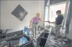  ?? JOHN THYS — AFP VIA GETTY IMAGES ?? Residents clean up their house after a flood in Chaudfonta­ine, near Liege, Belgium, on Friday. Belgium’s death toll stands at 20, with another 20 missing.