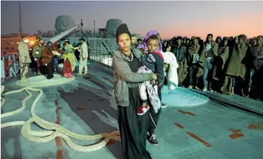  ?? PHOTO: REUTERS ?? Migrants arrive at a naval base in Tripoli after they were rescued by the Libyan coast guard.