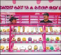  ?? WADE VANDERVORT ?? Doughnuts are displayed during a Pinkbox Doughnuts ribbon-cutting event in North Las Vegas.