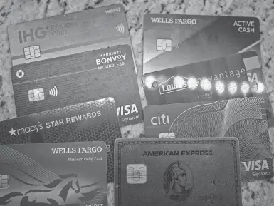  ?? MIKE STEWART/AP FILE ?? Credit cards can help you establish your credit history, provide extra protection­s on purchases and earn rewards on your everyday spending. Used carefully, credit cards can be a tool that helps you move toward other financial goals.