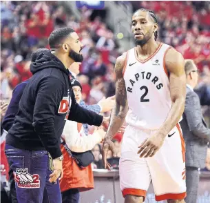  ?? FRANK GUNN THE CANADIAN PRESS ?? Drake, seen congratula­ting Kawhi Leonard, is spectacula­rly uncool, Rosie DiManno writes. He has no boundaries and the Raptors have been allowing his ridiculous interferen­ce and intrusion.