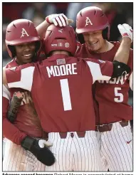  ?? (NWA Democrat-Gazette/Charlie Kaijo) ?? Arkansas second baseman Robert Moore is congratula­ted at home plate by teammates Christian Franklin (left) and Jacob Nesbit (5) after hitting a home run Saturday during the Razorbacks’ 5-0 victory over Gonzaga at Baum-Walker Stadium in Fayettevil­le. Moore finished 3 for 3 with 3 RBI and 2 runs scored. More photos are available at arkansason­line.com/223uabaseb­all/.