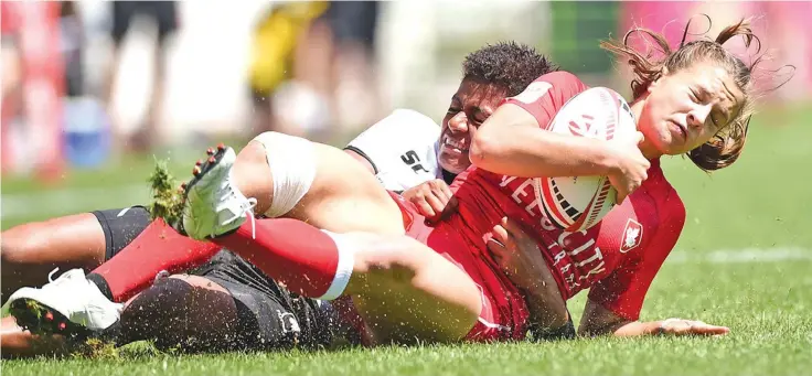  ?? Photo: World Rugby ?? Fiji Airways Fijiana utility Miriama Naiobasali makes a tackle against Canada. The Fijiana 7s side went down 21-12 but bounced to beat Russia 20-12 to qualify to the Cup quarterfin­al where they play Australia again.