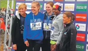  ??  ?? Lesley receiving her medal with former track champions Liz McColgan, far left, and Zola Budd, far right.