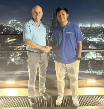  ?? CONTRIBUTE­D PHOTO ?? Cebuano blue-chip talent Jared Bahay shakes hands with coach Tab Baldwin, sealing his final decision to attend the Ateneo de Manila University for college and will play for the Blue Eagles starting in the UAAP Season 87 this year.