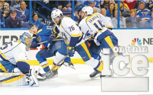  ?? THE ASSOCIATED PRESS ?? Nashville Predators goalie Pekka Rinne, defenseman P.K. Subban and defenseman Mattias Ekholm keep St. Louis Blues left wing Jaden Schwartz away from the puck during the second period in Game 5 of the NHL second-round playoff series Friday in St. Louis. Schwartz later scores as the Blues edged the Predators 2-1.