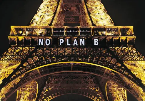  ?? FRANCOIS MORI / THE ASSOCIATED PRESS FILES ?? “NO PLAN B” is projected on the Eiffel Tower as part of the COP21, UN Climate Change Conference in Paris in 2015.