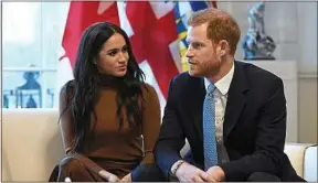  ??  ?? Le couple lors d’une visite à la Maison du Canada, à Londres, le 7 janvier.