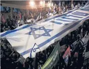  ?? SEBASTIAN SCHEINER/AP ?? Protesters rally against Israel’s Prime Minister Benjamin Netanyahu on Saturday in Jerusalem.