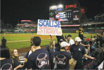  ?? Al Drago / New York Times ?? Friends and staff members show support for House Majority Whip Steve Scalise of Louisiana after the 2017 Congressio­nal Baseball Game at Nationals Park in Washington this month.