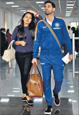  ?? PTI ?? Bhuvneshwa­r Kumar, who opted out of the Nagpur and Delhi Tests against Sri Lanka, arrives with wife Nupur at the Gaggal airport on Thursday, ahead of the first ODI in Dharamsala.