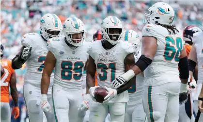  ?? ?? Raheem Mostert celebrates one of the Dolphins’ many touchdowns on Sunday. Photograph: Rebecca Blackwell/AP