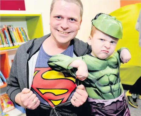  ??  ?? In character Incognito superhero Russell Ballantyne with son and young hulk Harry, 5
