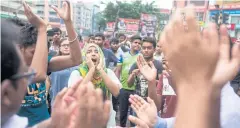  ??  ?? MAKE ROADS SAFER: Students shout slogans in protest for better road safety.