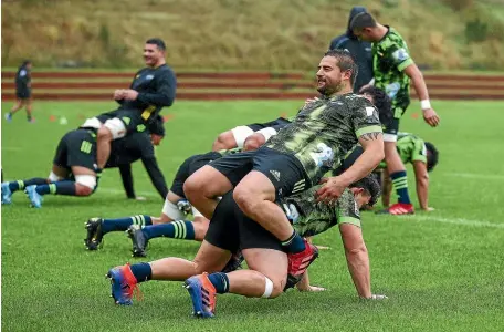  ??  ?? Hitching a ride: Hookers Ricky Riccitelli and Dane Coles at training at Rugby League Park in Wellington.