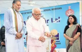  ?? HT PHOTO ?? Haryana chief minister Manohar Lal Khattar lighting a lamp to inaugurate ITECH (Industry and Technical Excellence Changing Haryana) at Manesar in Gurugram on Wednesday. State technical education minister Ram Bilas Sharma is also seen in the picture.