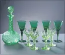  ??  ?? BEQUEST: A selection of glassware from Lethenty Venetian wine glasses (dark green) circa 1970s; antique English wine glasses (apple green) circa 1830; and a glass decanter.