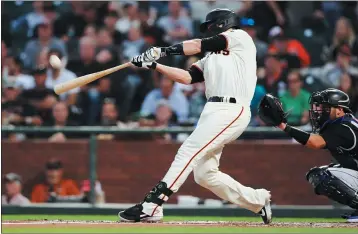  ?? RAY CHAVEZ — BAY AREA NEWS GROUP FILE ?? The San Francisco Giants’ Buster Posey (28) hammers a two-run homer run off Colorado Rockies starting pitcher Jeff Hoffman in the first inning at Oracle Park in San Francisco on Sept. 24.
